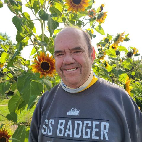 Adult with sunflowers